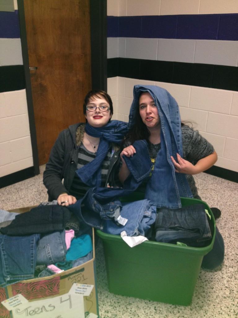 GSA Club president, Kylie Jefferis, works to sort through a variety of donated jeans with the help of other club members. 