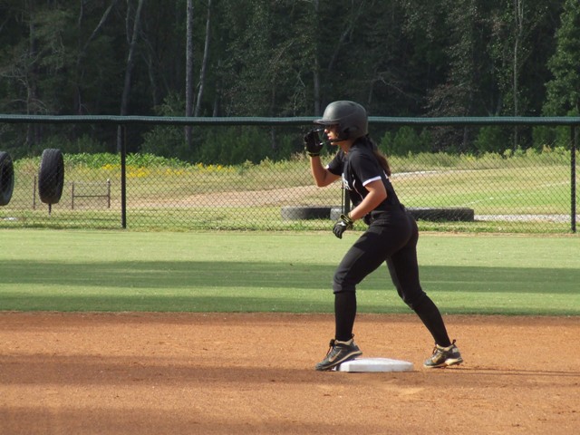 Jaimee+Davis%2C+sophomore+and+Junior+Varsity+Lady+Raiders+catcher%2C+stands+on+second+base+after+her+steal+to+second+on+a+wild+pitch+at+home+plate.+She+caught+for+the+entirety+of+the+game+for+pitcher+and+junior%2C+Courtney+Walls.