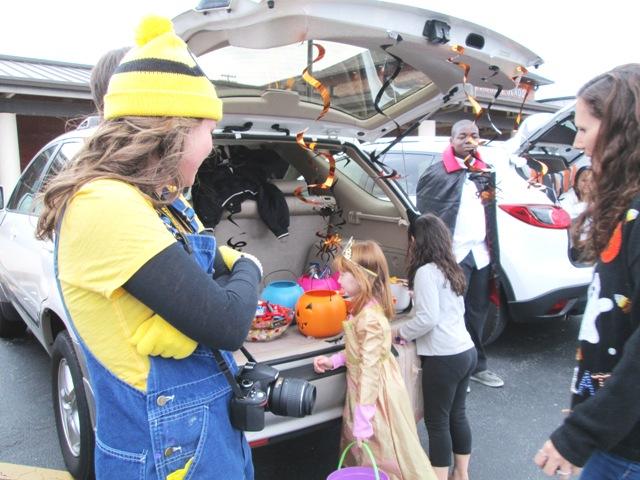 With glowing faces, the kids of the community utilize the fun festivities Student Council provides during Trunk or Treat. Even the student volunteers are enjoying themselves this crisp Halloween evening.