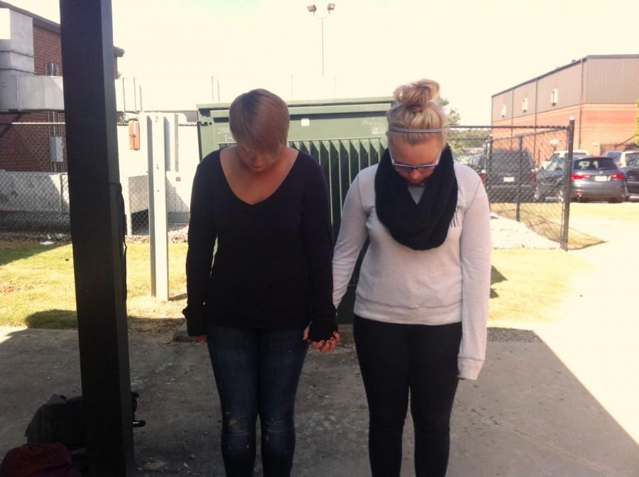 “I love my short hair. It frames my face better than long hair, and much easier to handle,” freshmen, Tessa Bacon (on the left) stated and Sydney Dean (on the right). “I may not be skinny, but I love my body,” Sydney gushed happily. They stand there hand and hand as a symbol of they are empowered without being the “perfect woman”. 