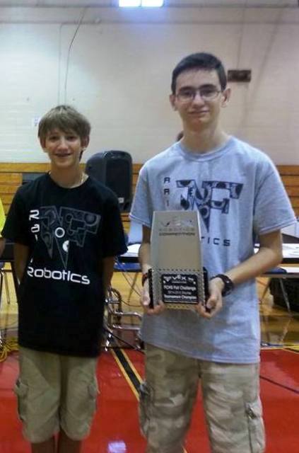 After being proclaimed as the Winners of the Vex championship tournament Nick Fornack (left) and Jacob Buffkin (right) were proud to represent NFHS as they held up their 1st place trophy.  Now Nick and Jacob are looking forward to break out their machine again next year to defend their championship title.
