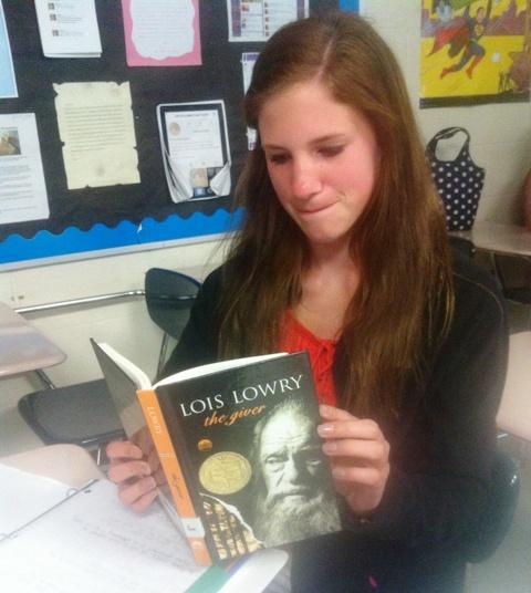 Engaged with the story that is unfolding before her, Sarah Klein, freshman, comments, “The book has an interesting story, but has some dull moments.”