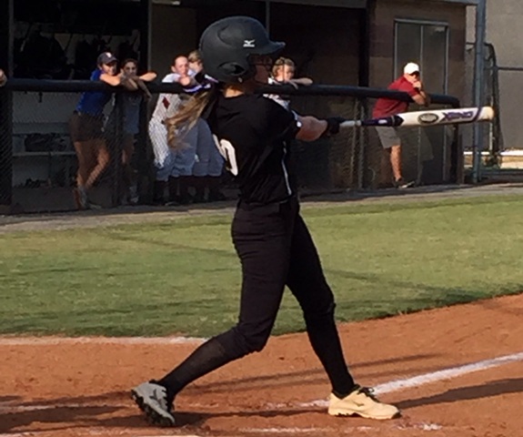 Sophomore Lauren Hogan brings in a run with a good hit in the second inning.