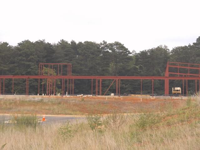 The construction crew has established some beams and frames, as well as the first layer of concrete. The new building has plans to offer amenities and offices that the current building does not.   