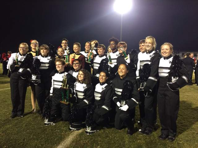 The Raider Marching Band officers pose with the band’s awards after the ceremony.  Photo by Tracy Grose.
