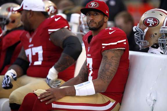 Kapernick’s simple act of sitting has both inspired admiration and hate. (Source: http://madworldnews.com/kaepernick-nfl-executives/)