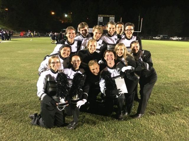 The photo is of the officers after the band placed an overall ‘Excellent” ranking at the Collins Hill competition. Depicted in the photo is: Dory Owen (bottom left), Janie Milwood, Drey Woodson, Steven Burden, Marissa Dintino, Elizabeth Dollar, Daniella Hernandez, Anna Grace Brown, Mathew McFadden (top left), Johnathan Buwalda, Bailey Kenzivich, Mikayla Eardhart, Luke Fizone, and Steven Kemp (top right).
