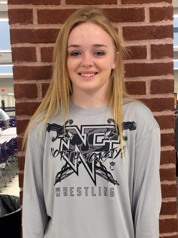 Sophia Eglian is sporting her wrestling shirt. All of the athletes of North Forsyth work hard every day in and out of playing season to help our sports teams be the best in the county.
