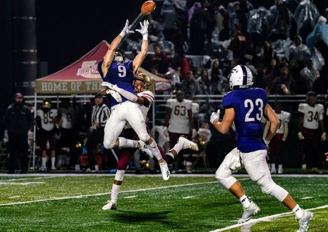 Nicky Dalmolin leaping to get a touchdown at the Playoffs on Nov. 8.
Photo by: Ben Hendren
