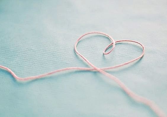 The yarn forms a heart to represent
 the love and pureness explained in the poem.
Photo from Pinterest. By Suzannah Clemn
