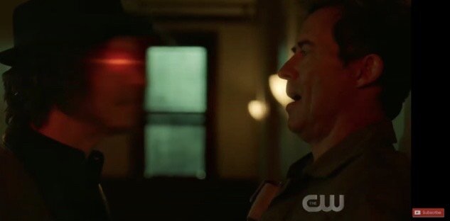  Nash is talking to his hallucination. The guy in the hat is the hallucination and the guy on the wall is Nash. (Photo from the CW.) 