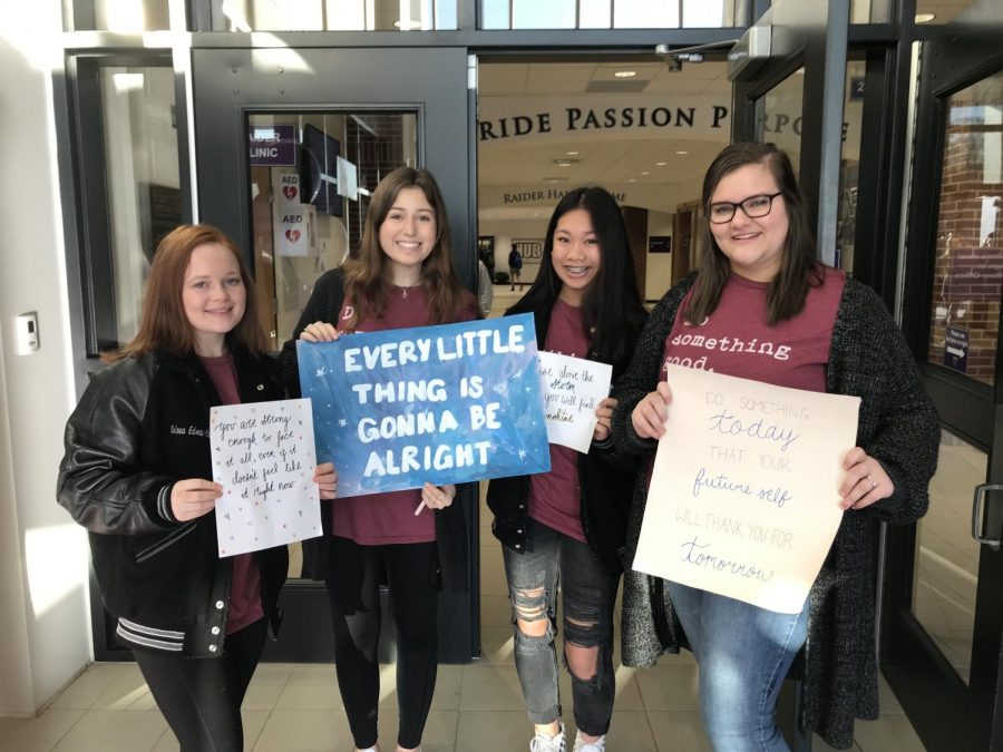 Sophomore Chelsea Edwards, Junior Audrey Altman, Junior Grace Pilibino and Junior Beth Laura stood by the front entrance of the school to greet North students.
