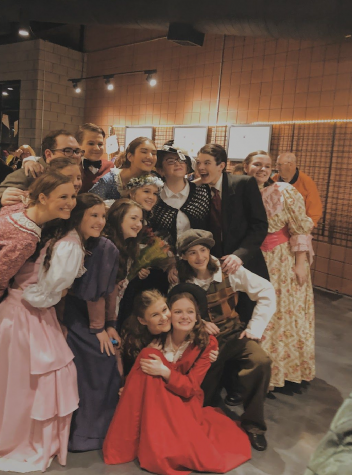 Some of the cast posed in the lobby after a successful opening night on March 5 before completing two more shows that weekend. (Photo By: Peyton Stenander).