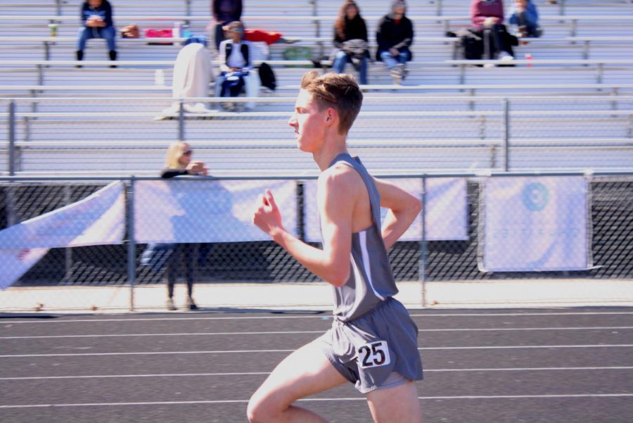 Running his last event, freshman Brock Casey relentlessly carried through his final laps in the 3200 meter run finishing the race at 11:05.