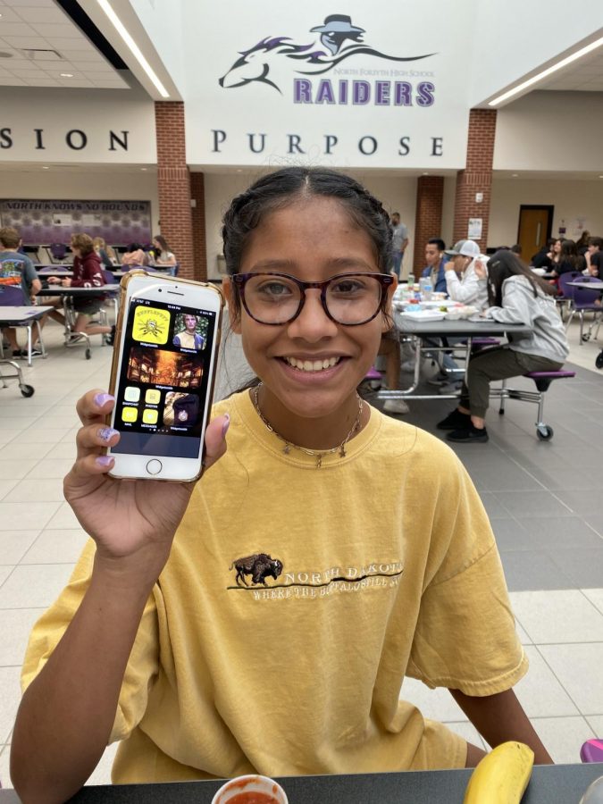 Maddison Madrigal shows her new home screen theme based on the Hogwarts house, Hufflepuff. Photo by Melody Scott.
