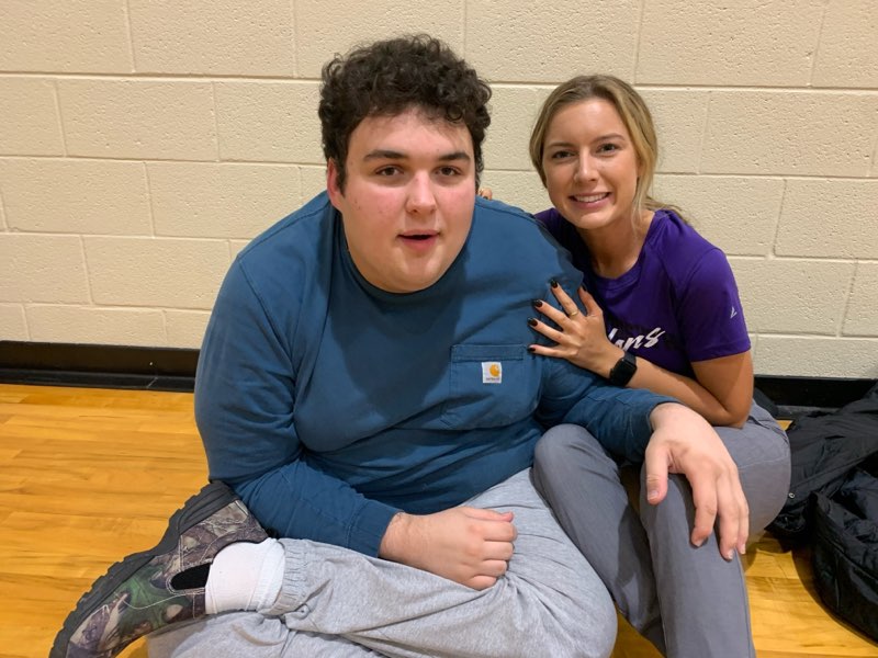 Special Education teacher and Track & Field coach Kelsey Ballou and sophomore Dylan Garonzik sitting in-between station breaks. Photo by Kelsey Ballou.