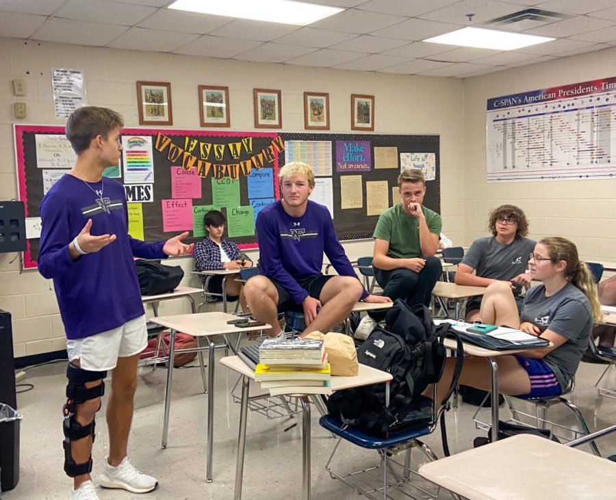 Juniors Dillon Thomas, Cooper Eglian and Andrew Burruss have an in-depth discussion during the SPECKS club meeting, a new club without service hours (Photo by Sarah Treusch).