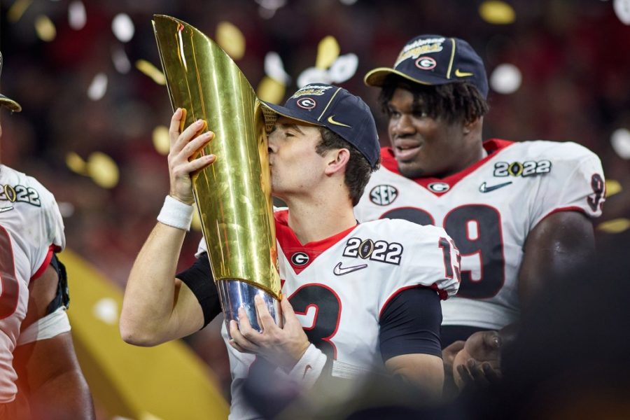 Georgia+starting+quarterback+Stetson+Bennett+IV+kisses+the+CFP+National+Championship+Trophy.+%28Photo+by%29+%40georgiafootball+on+ig%0A