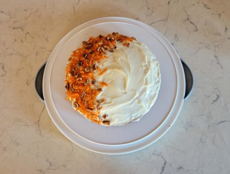 The homemade one-layer carrot cake with cream cheese frosting, topped with leftover grated carrots and chopped pecans. Photo by Cynda Allen.