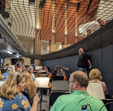 Eugene Seese conducting the orchestra during the Materna Requiem rehearsal. Photo by the Focal Center Instagram.