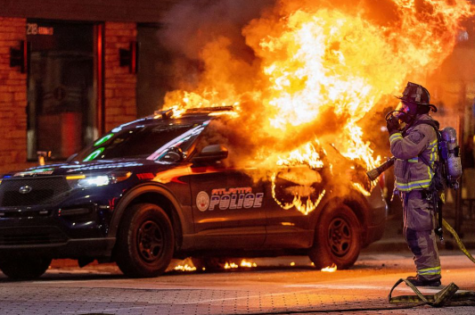 Firefighters responded to a blazing Atlanta cop car after violent protesters lit it on fire.