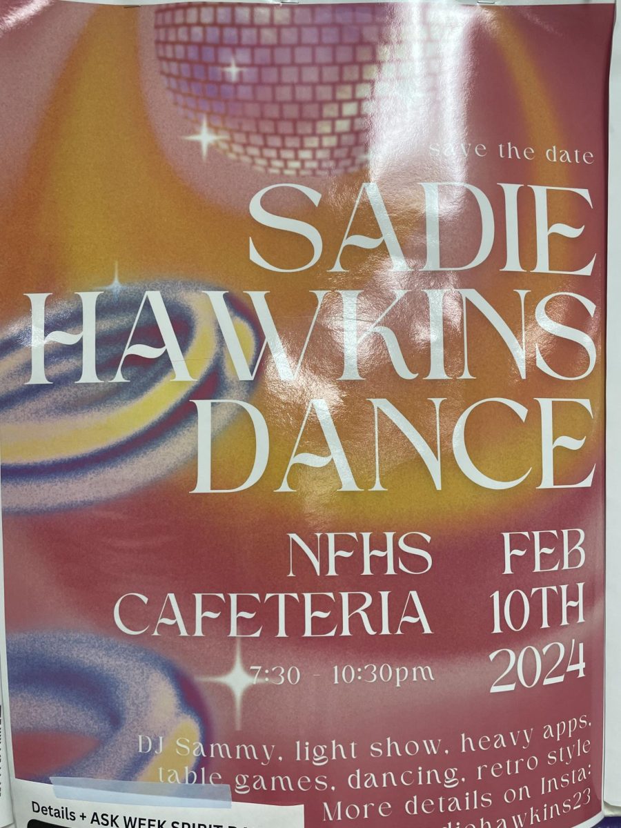 Poster+of+Sadie+Hawkins+Dance+info+located+in+the+main+hallway+of+the+school.