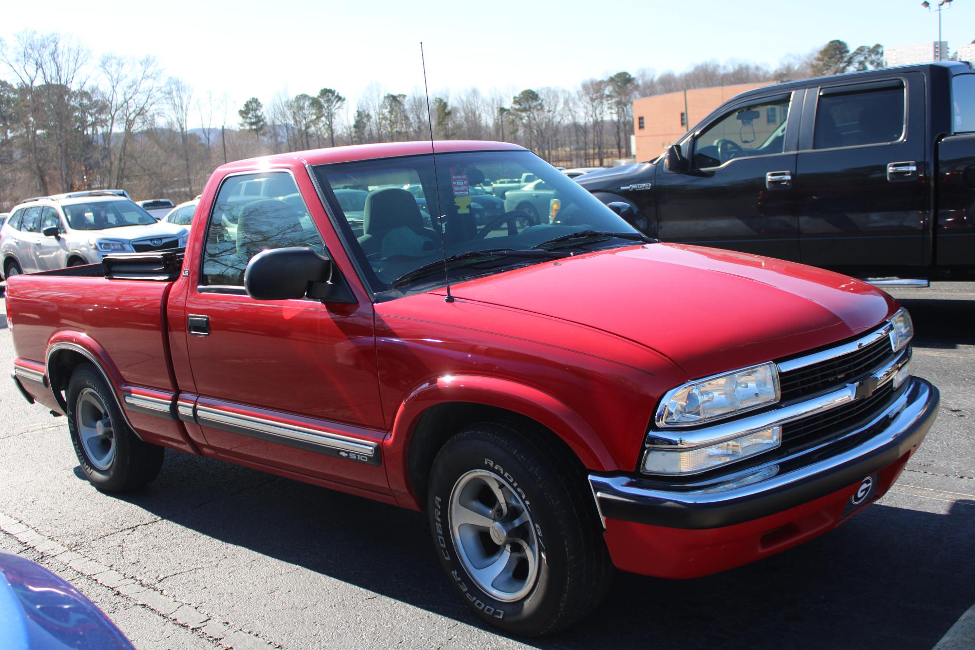 Fowler’s red chevy glistens in our school lot