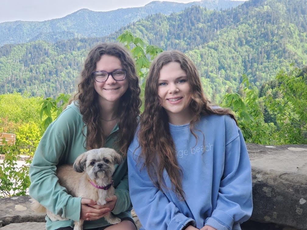 My Sister, My dog, Heidi, and I posing in front of the mountains of Tennessee.