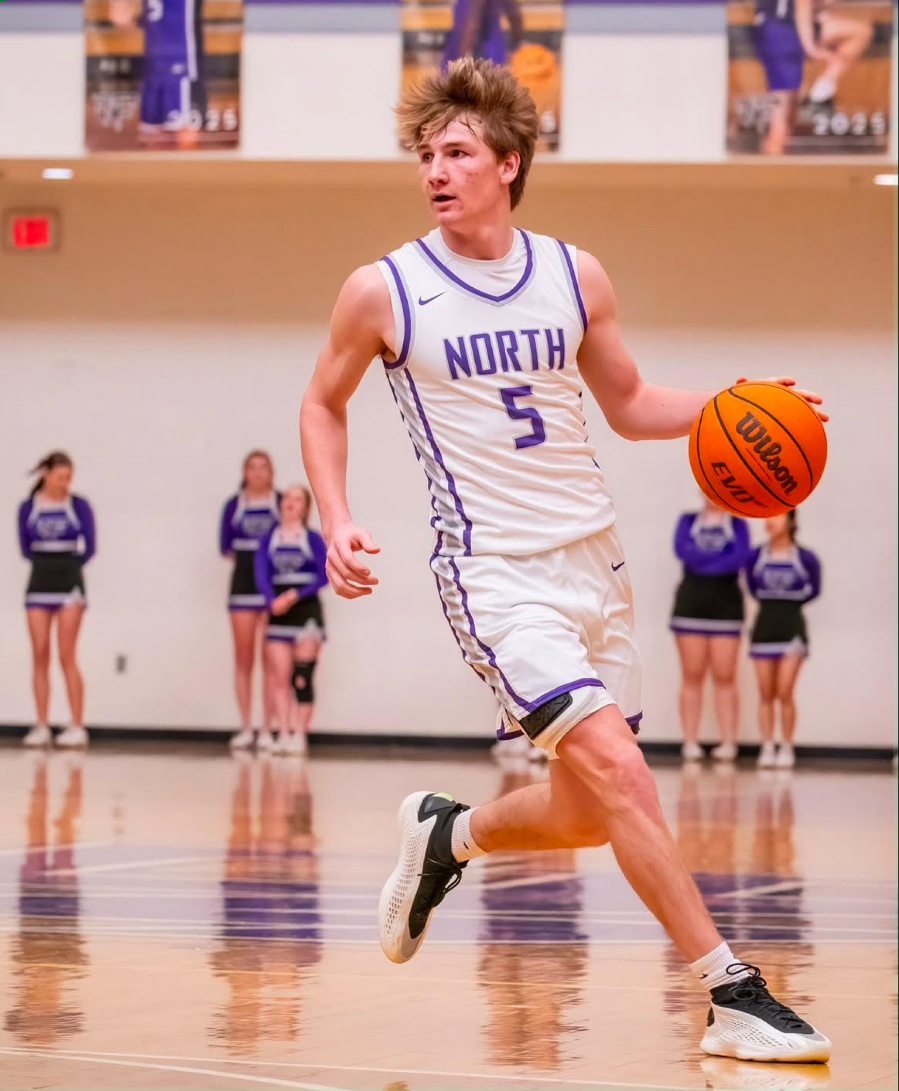 Senior Guard Ty Womack dribbles the ball up court in crunch time.
