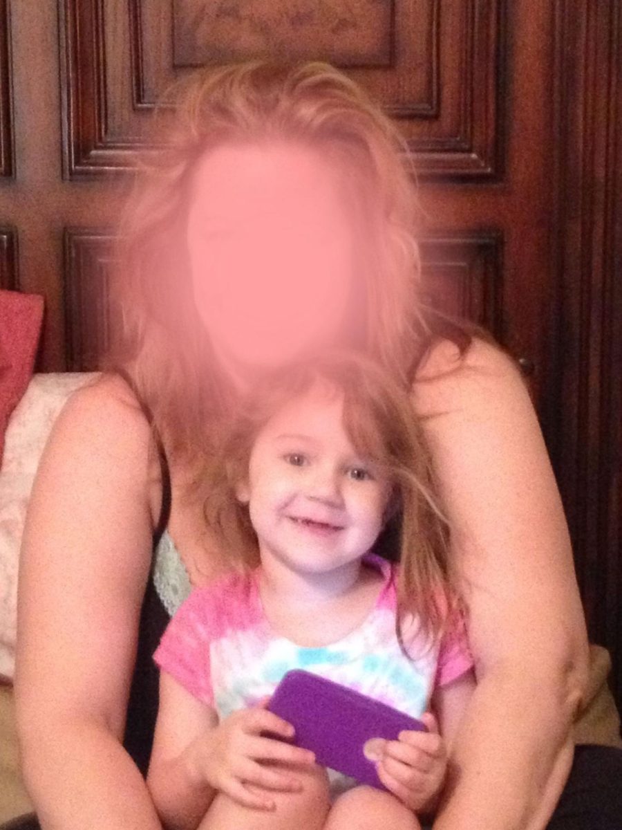 A younger version of me in my mothers arms
