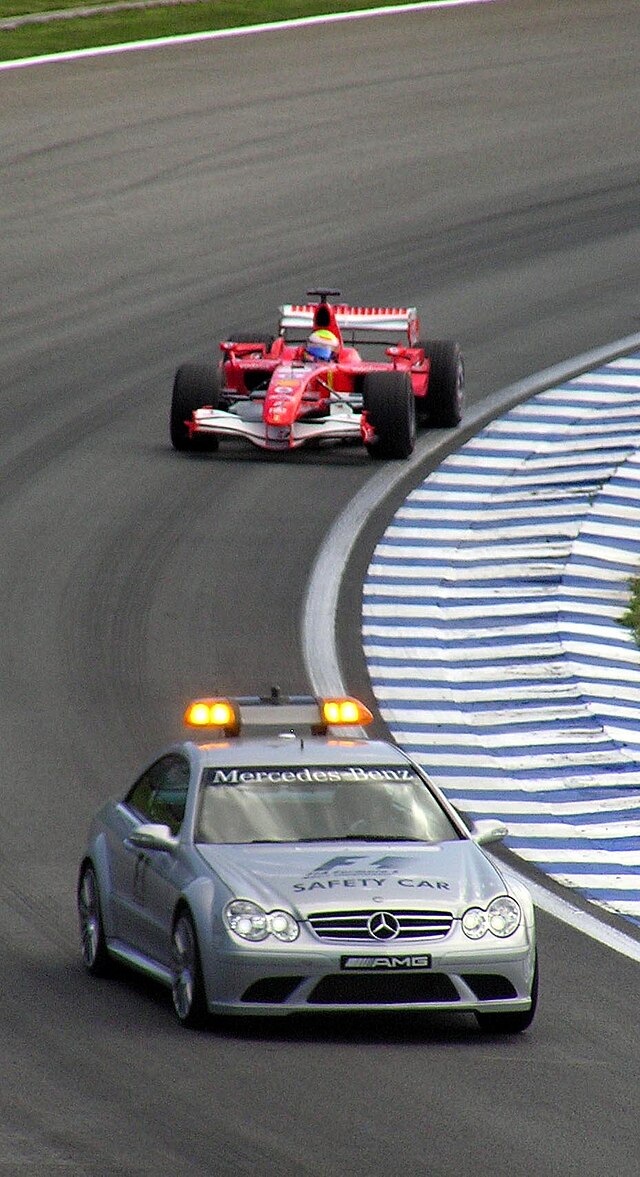 Massa Felipe’s Scuderia Ferrari trails the Safety Car, winning the 2006 Brazilian Grand Prix.