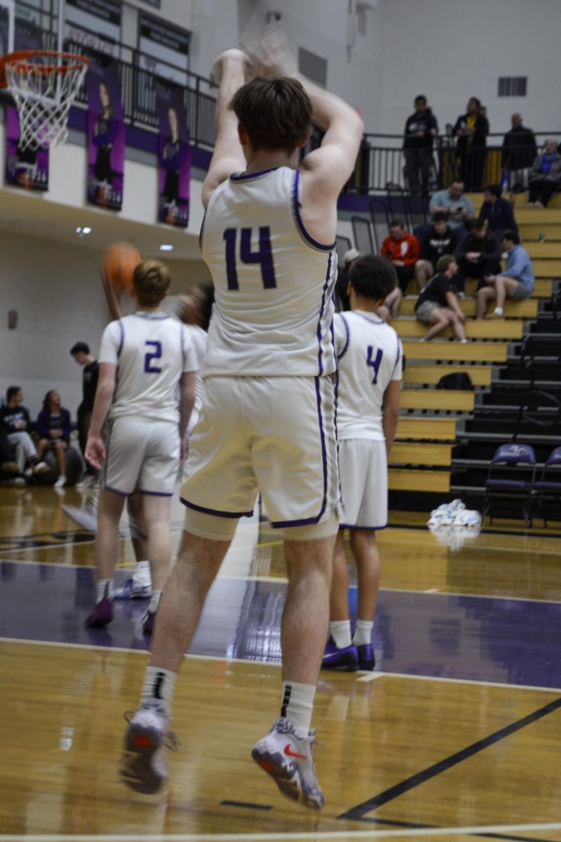 Number 14 for the Raiders, Grant Sagro, scores a three-pointer.
