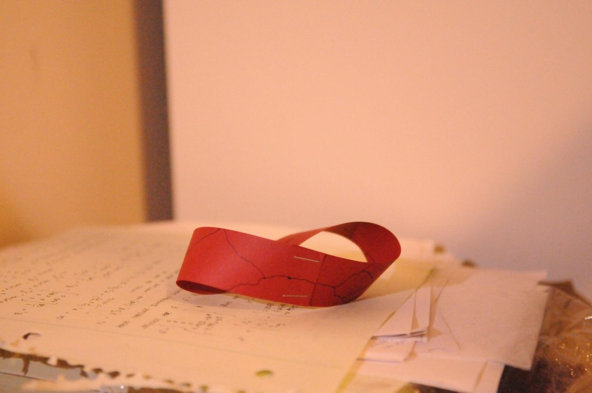 The mobius strip has a singular, unending side, constantly looping back onto itself.
