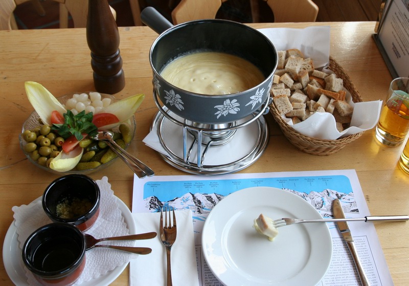 Soak in the richness of cheese with your favorite dipper for National Cheese Fondue Day
